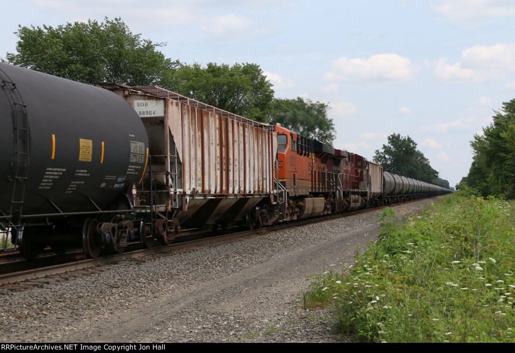 The mid train power of 67X approaches in the middle of combined empty ethanol trains